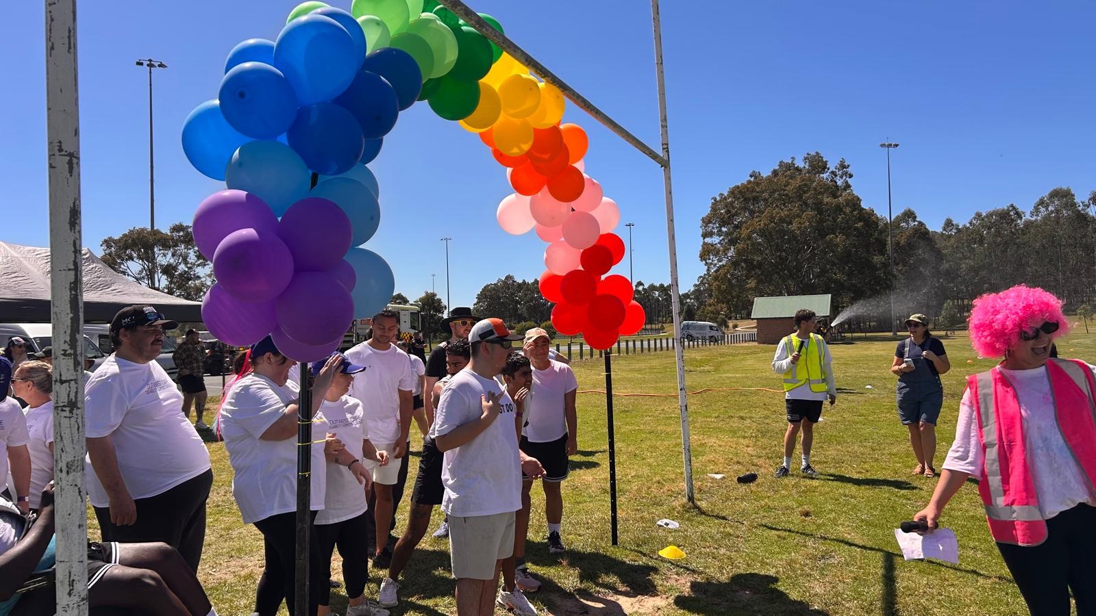 Runners at the balloon arch start line