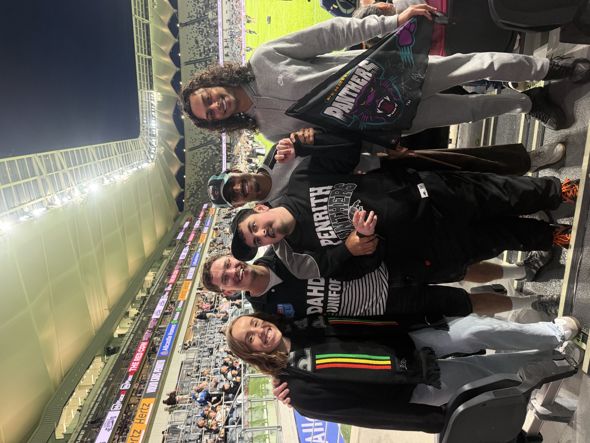 Adults on a social night outing at a Penrith Panthers NRL game